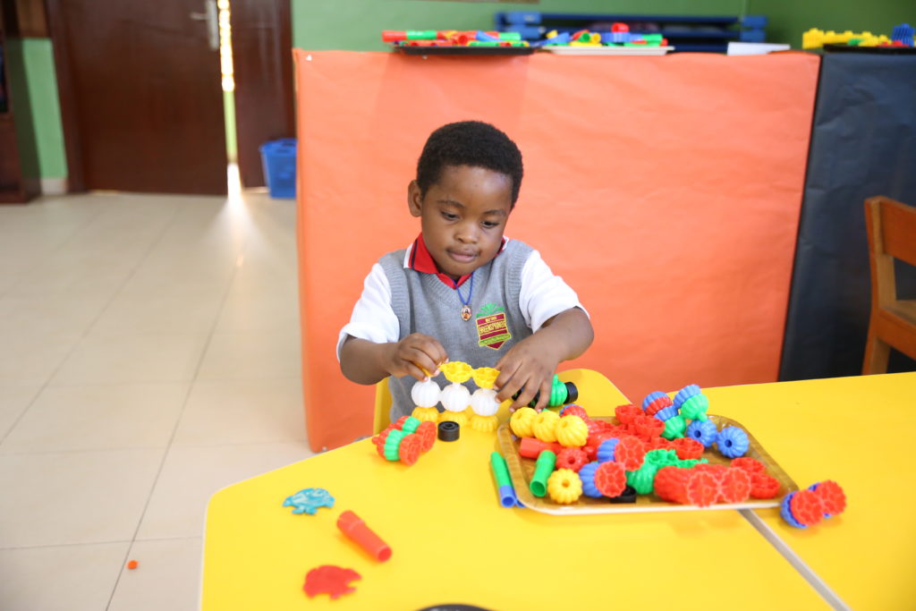 Student playing in the classroom