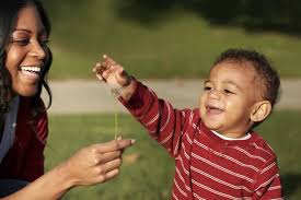 Parents playing with child